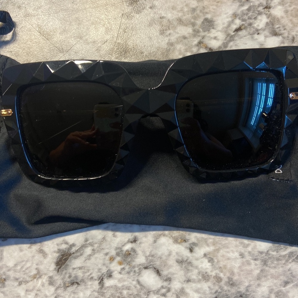 Dolce and Gabanna - like new sunglasses. Two pairs available. Black and Red